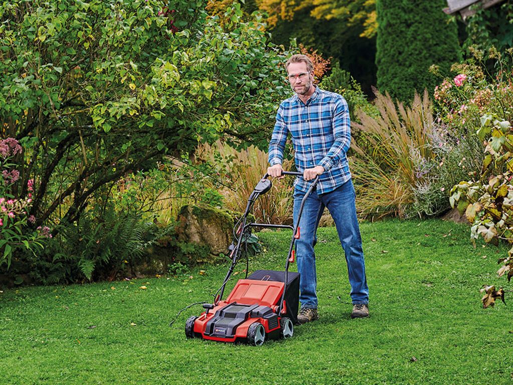 a man scarifies his lawn