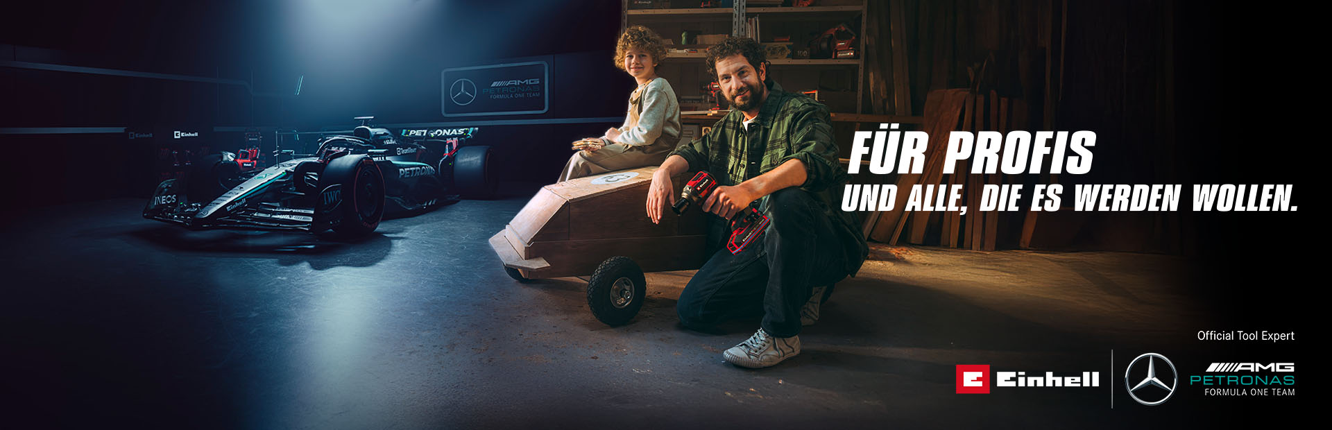 A father and child in a workshop with a homemade soapbox car. In the background, a Mercedes-AMG PETRONAS Formula One car and Einhell tools. Text on the right reads: "For professionals and those who want to become one."