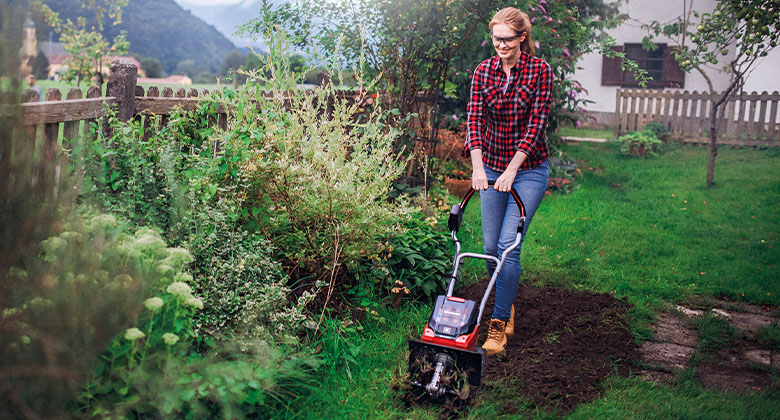a woman chops up the earth