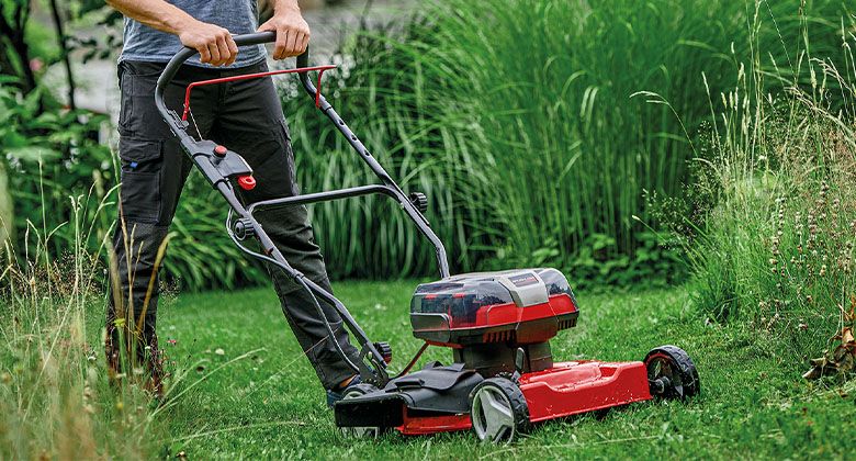 A 36 V battery mower with four battery slots.