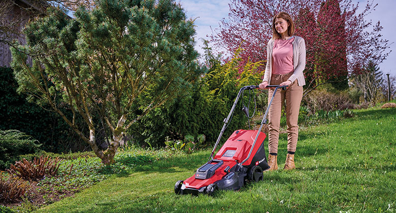 A woman mowing the lawn
