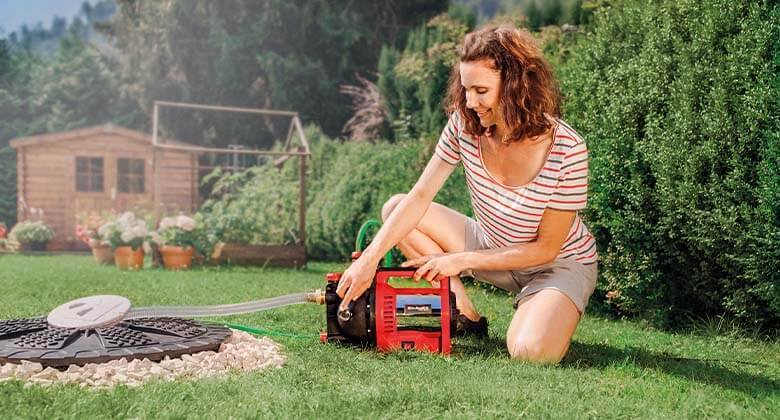 a woman turns on the water pump